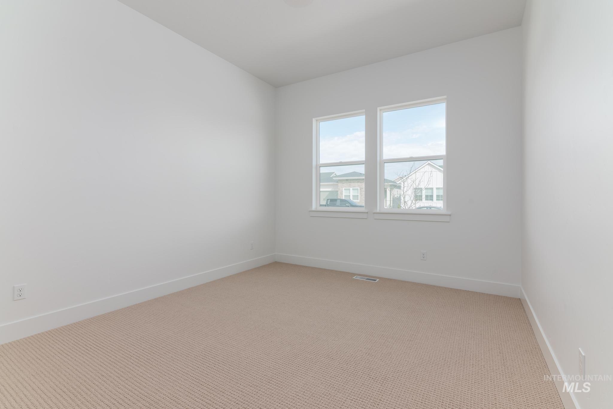 8531 West Chamblee Street Star, ID 83669 - Photo 18 of 37 Spare room with light colored carpet and baseboards