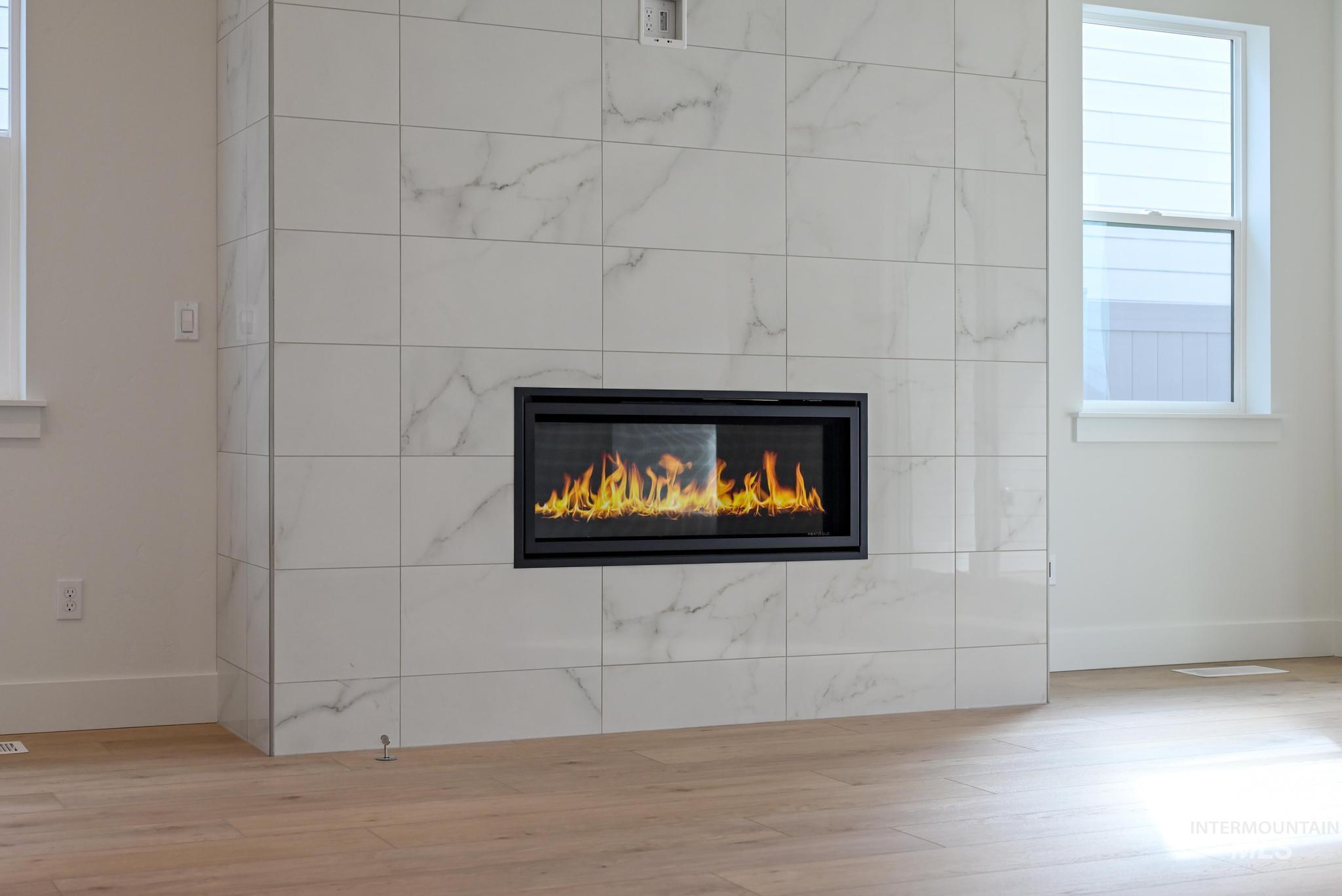 8531 West Chamblee Street Star, ID 83669 - Photo 5 of 37 Detailed view of wood finished floors and a fireplace