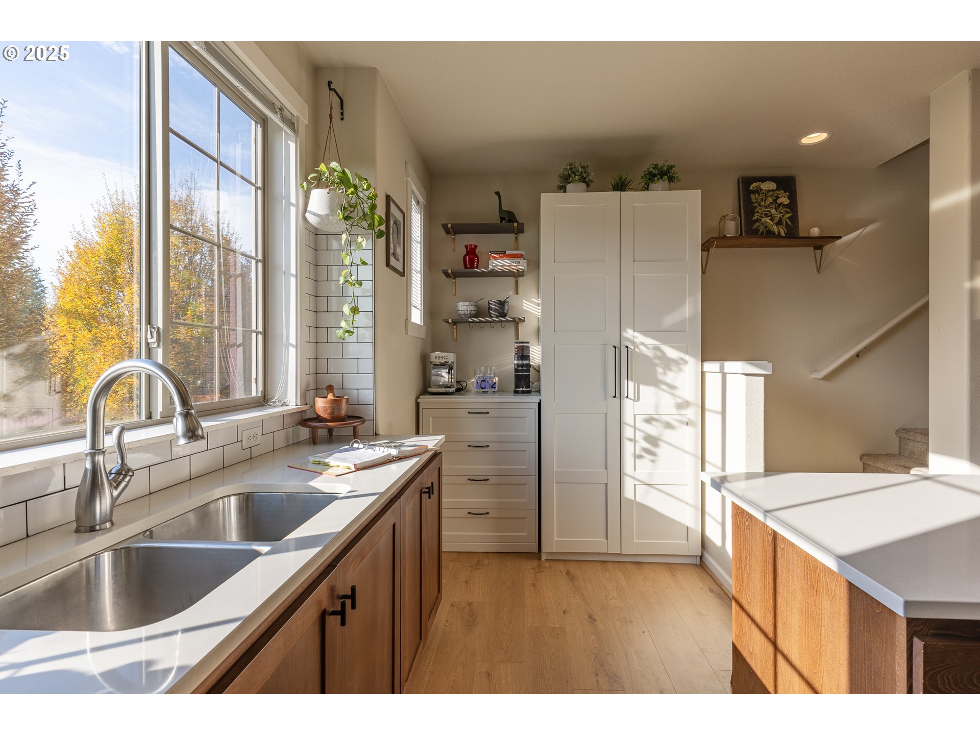 7974 Northeast Heiser Street Hillsboro, OR 97006 - Photo 11 of 32 a kitchen with a sink a refrigerator and a stove