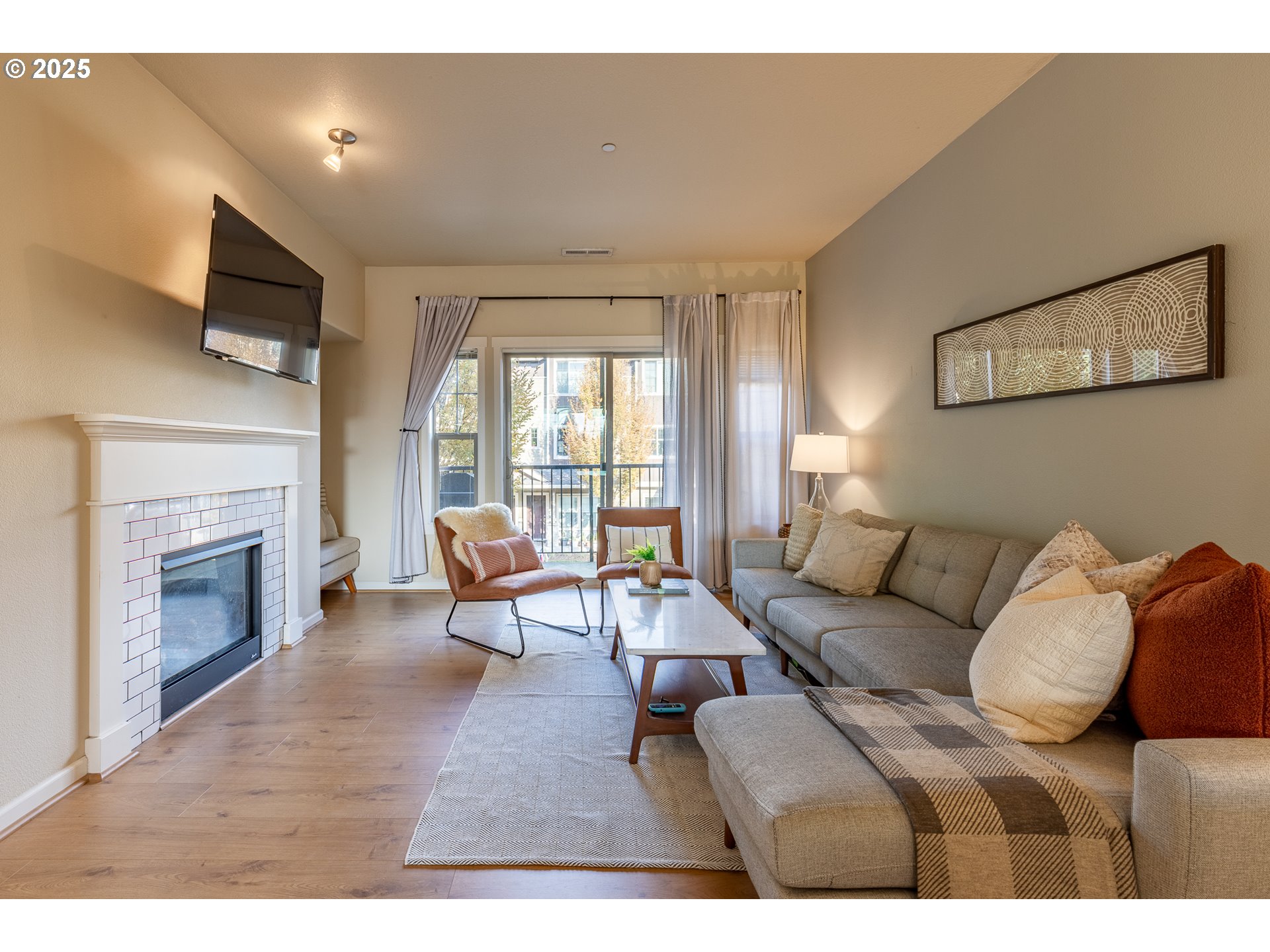 7974 Northeast Heiser Street Hillsboro, OR 97006 - Photo 15 of 32 a living room with furniture and a fireplace