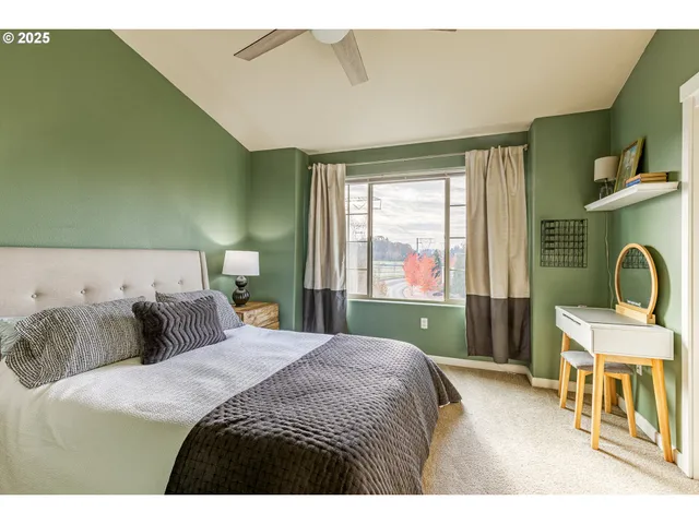 a bedroom with a bed and window