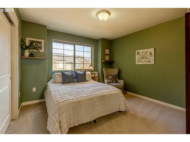 a bedroom with a bed and window