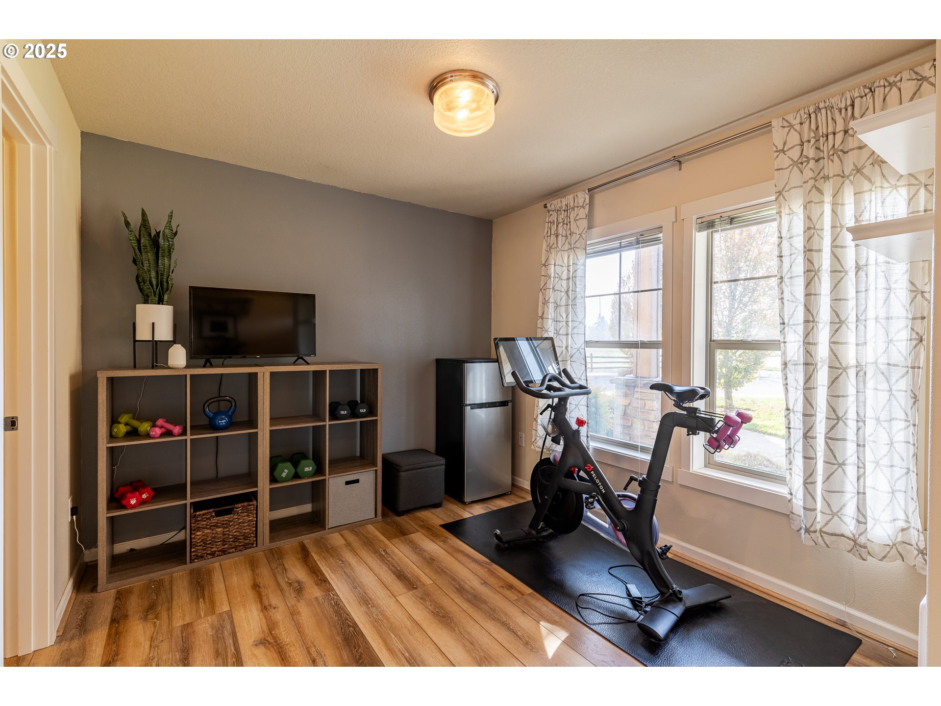 7974 Northeast Heiser Street Hillsboro, OR 97006 - Photo 3 of 32 a view of a workspace with furniture and a window