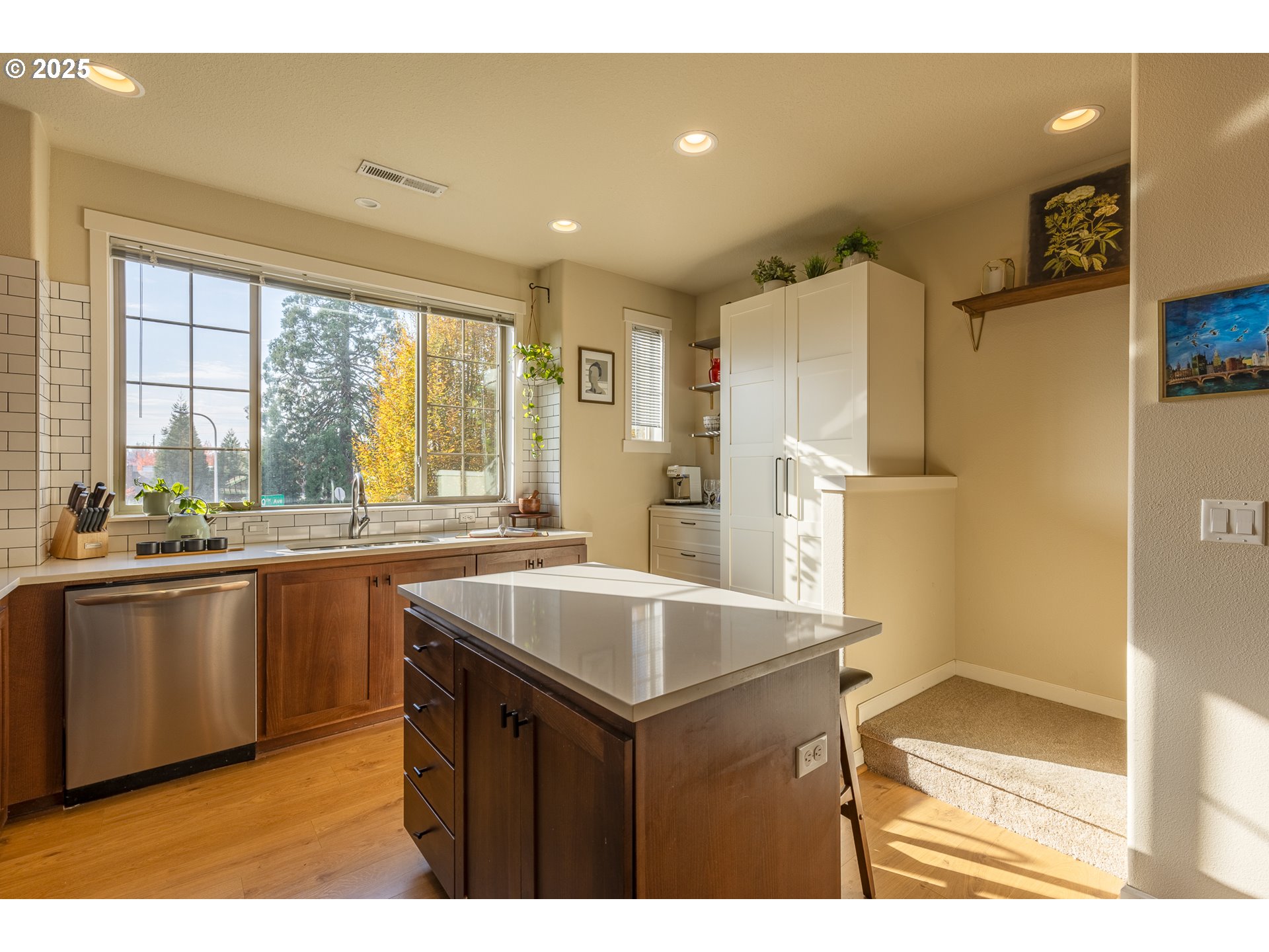 7974 Northeast Heiser Street Hillsboro, OR 97006 - Photo 7 of 32 a kitchen with a sink and large cabinets