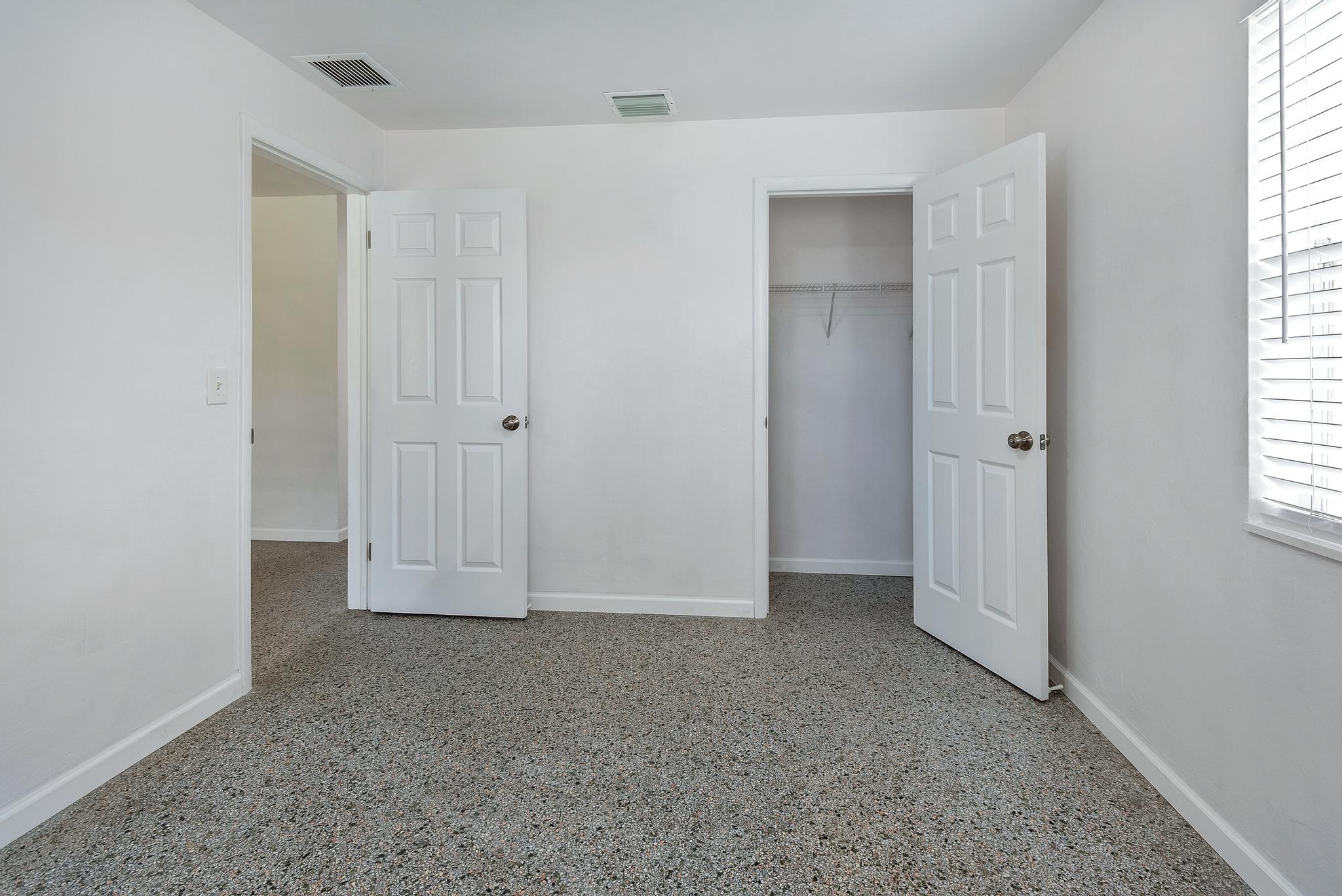 4882 Jefferson Road Delray Beach, FL 33445 - Photo 24 of 41 an empty room with windows