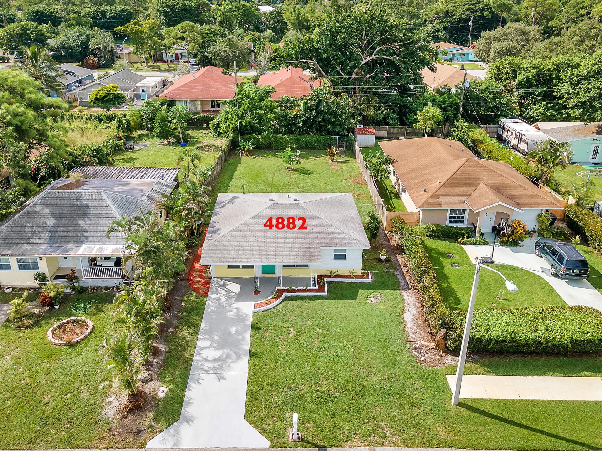 4882 Jefferson Road Delray Beach, FL 33445 - Photo 3 of 41 a sign that is sitting on a brick ground