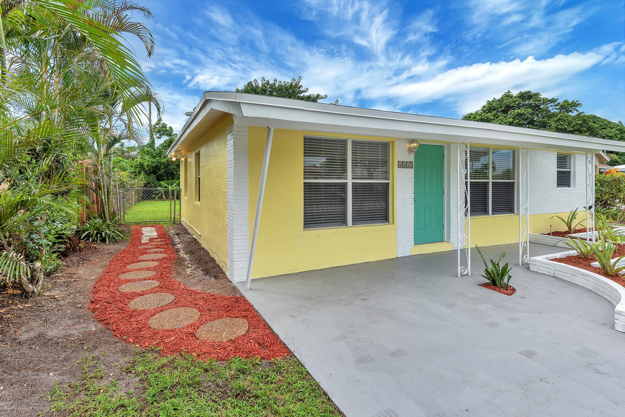 4882 Jefferson Road Delray Beach, FL 33445 - Photo 35 of 41 a view of a house with backyard and porch