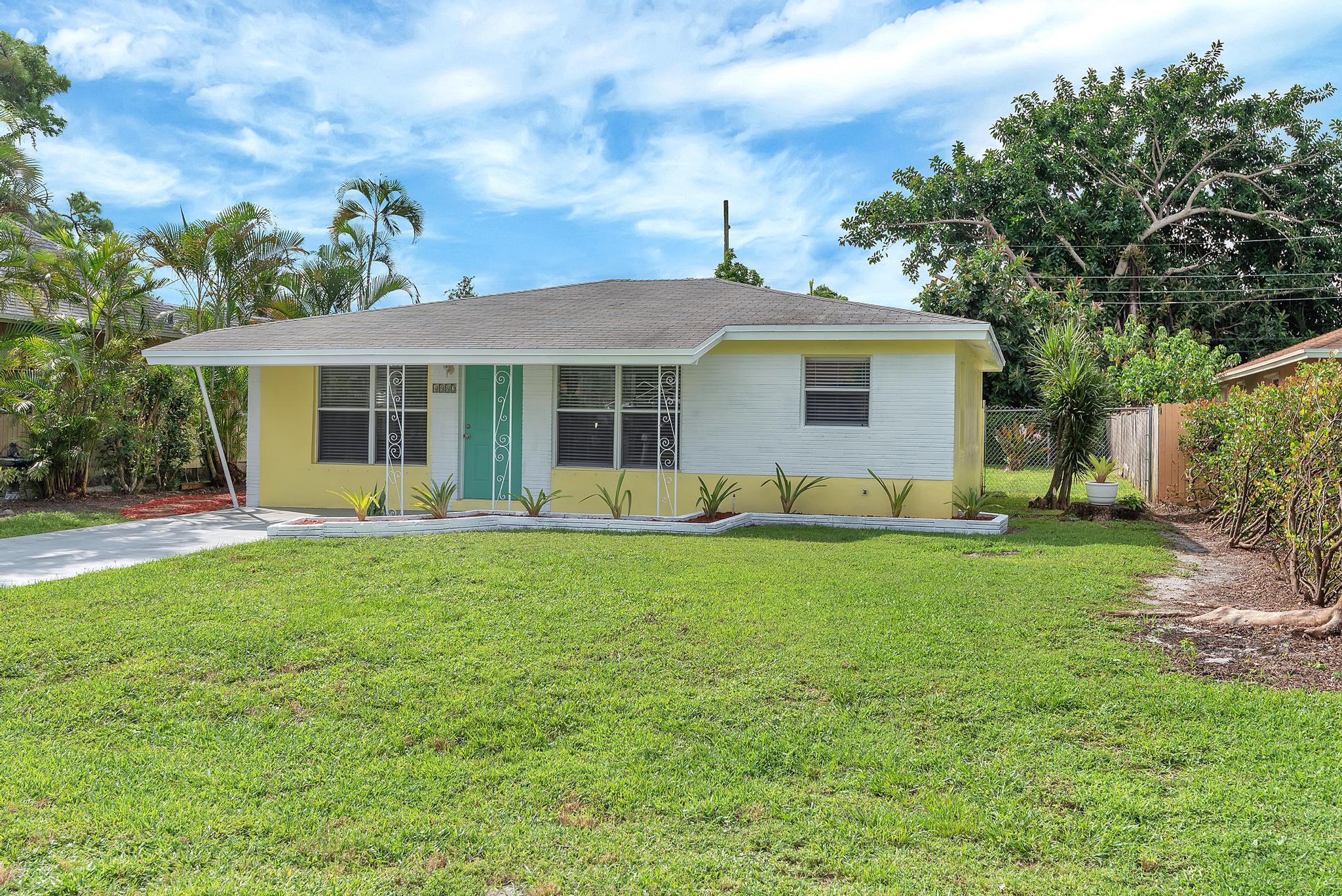 4882 Jefferson Road Delray Beach, FL 33445 - Photo 39 of 41 a front view of house with yard and green space