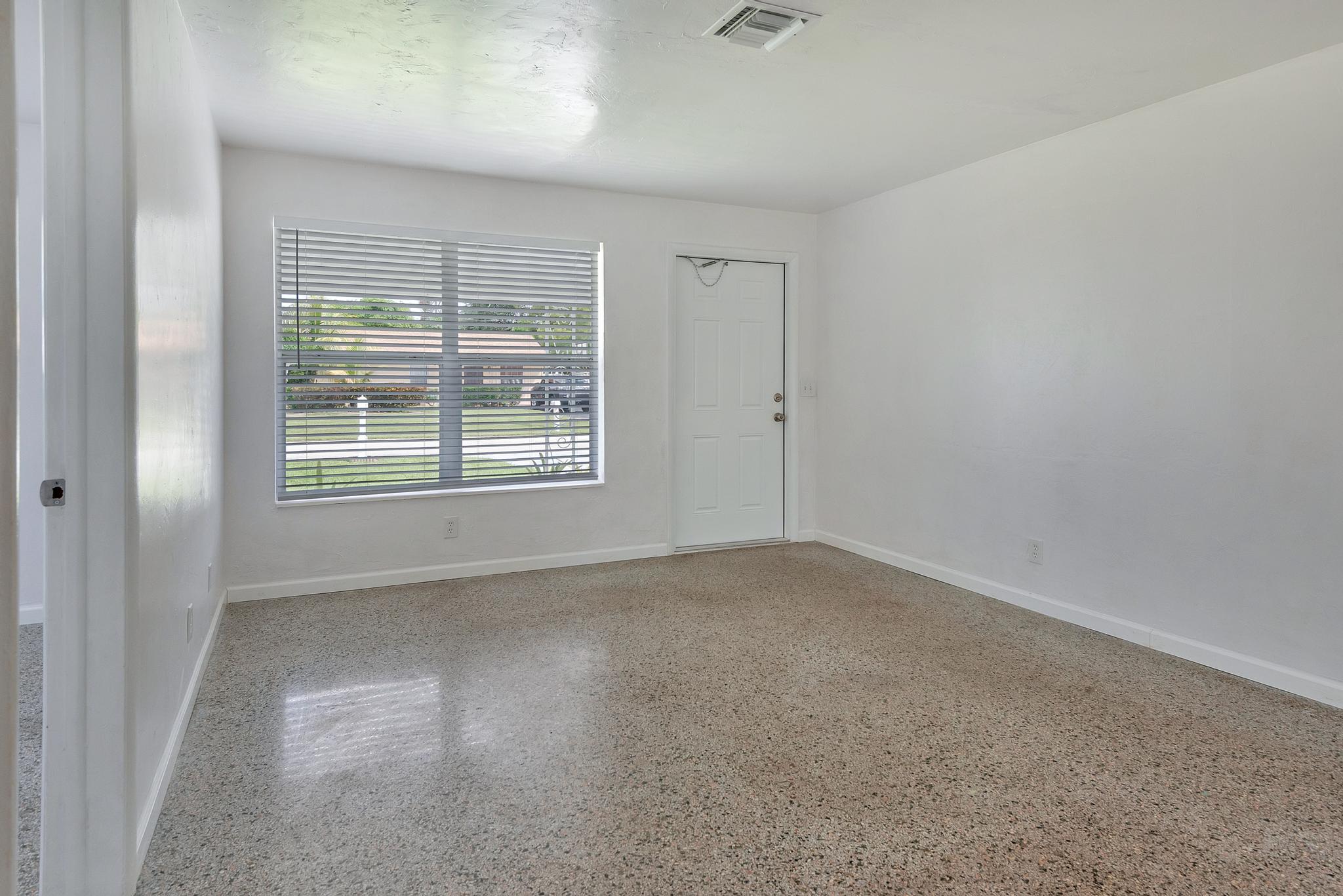 4882 Jefferson Road Delray Beach, FL 33445 - Photo 5 of 41 an empty room with windows