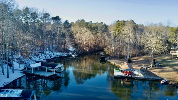 a view of dirt yard with a large tree