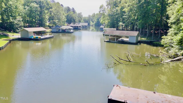 a backyard of a house with a yard and outdoor seating