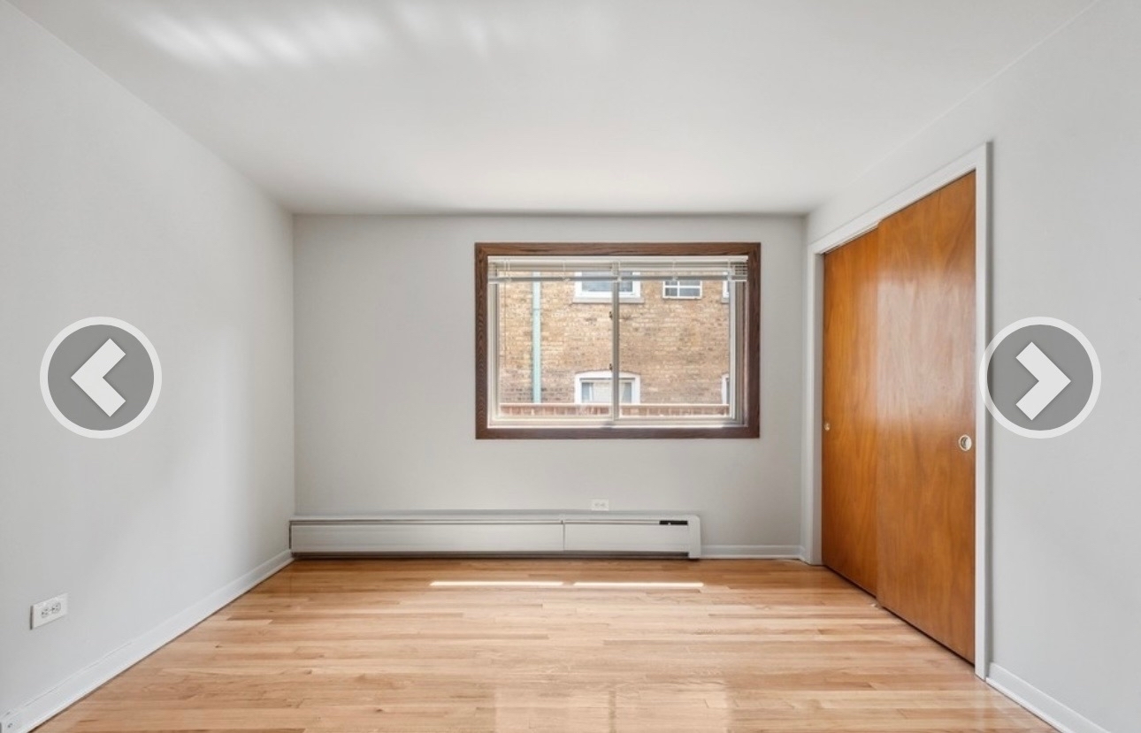 7019 North Ridge Boulevard, Unit 3B Chicago, IL 60645 - Photo 5 of 6 a view of a livingroom with wooden floor and window