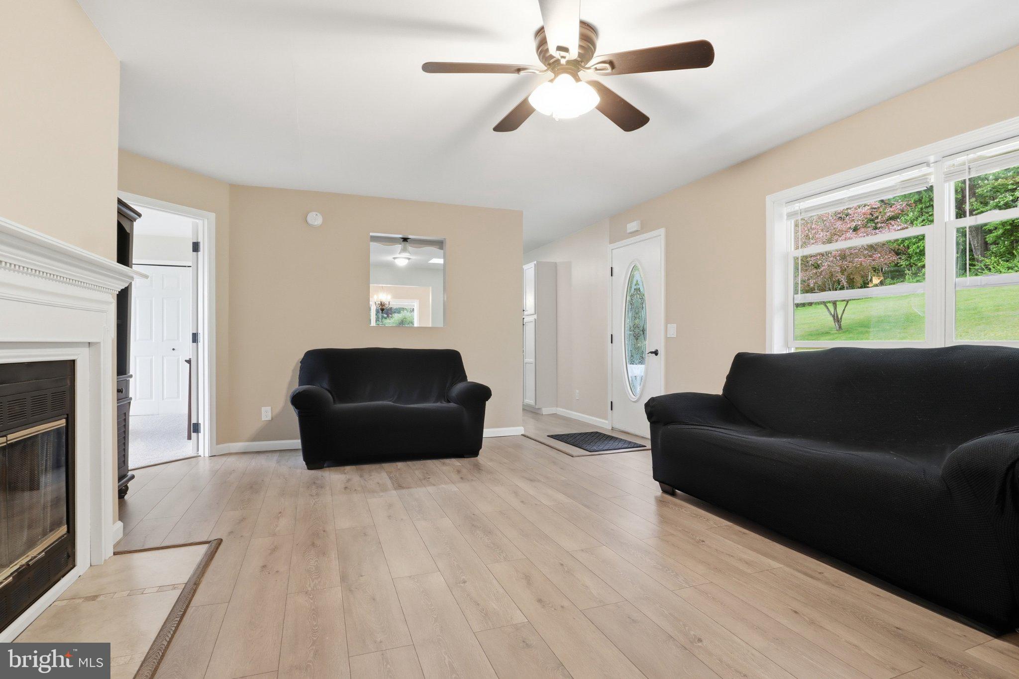 491 Garvine Mill Road Fawn Grove, PA 17321 - Photo 7 of 47 a living room with furniture and a large window