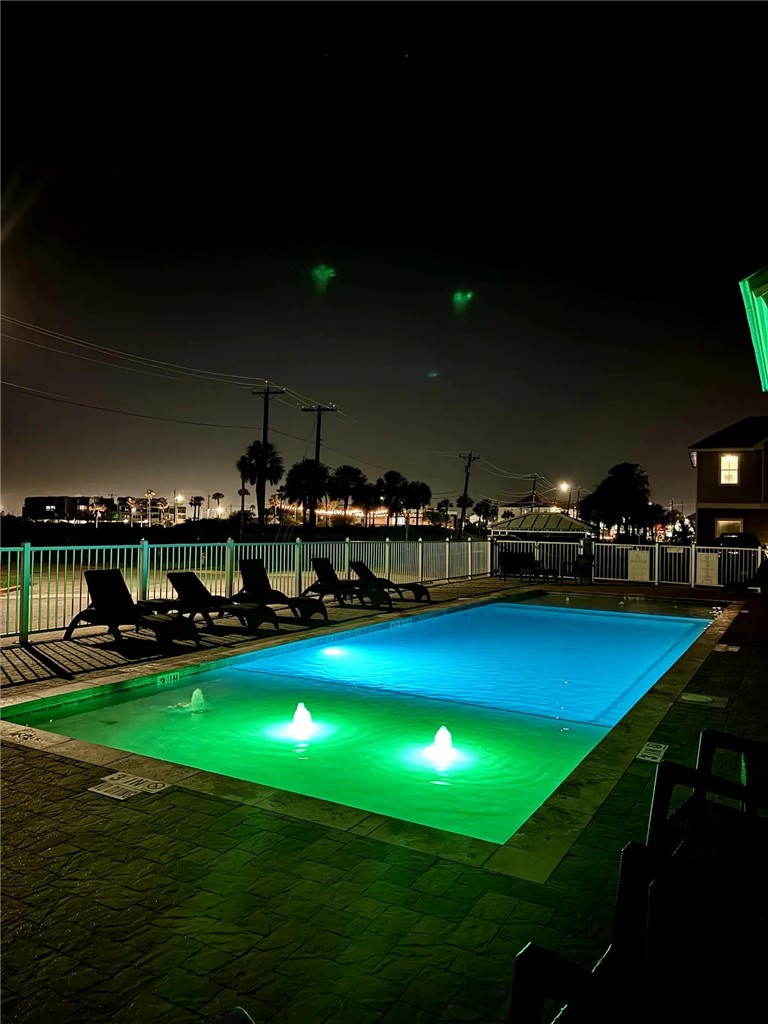 14310 Ridley Way Corpus Christi, TX 78418 - Photo 3 of 19 a view of a swimming pool with an outdoor space and seating area
