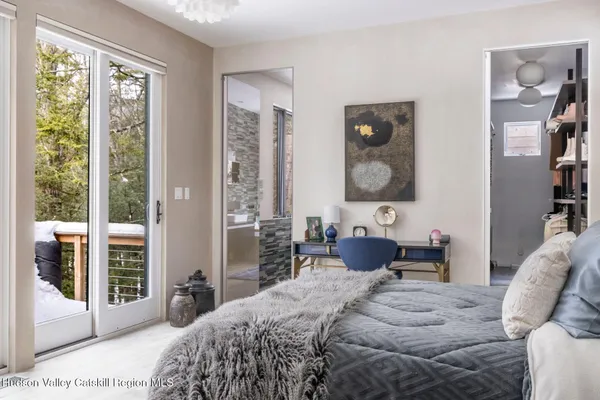 a bedroom with furniture and a bed