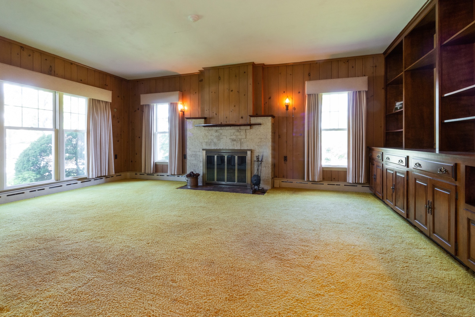 1401 Garfield Road Harvard, IL 60033 - Photo 3 of 20 a view of an empty room with a fireplace and a window