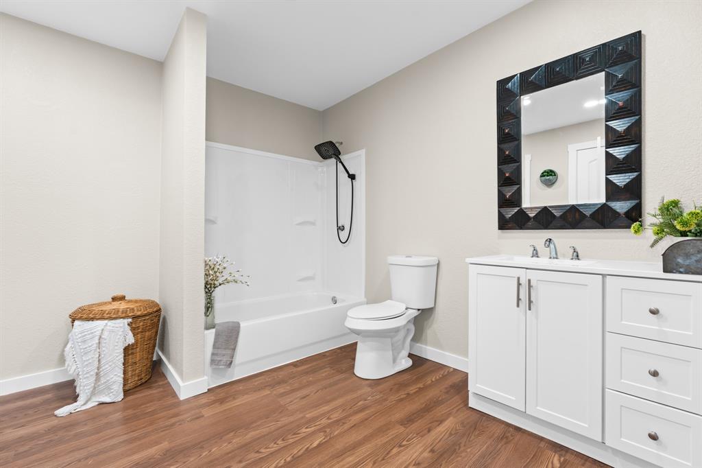 175 Hcr-4434 Itasca, TX 76055 - Photo 12 of 30 a bathroom with a sink a toilet and shower