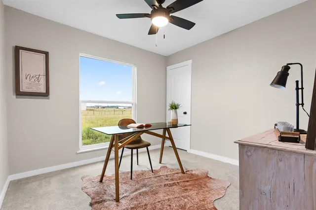 a workspace with furniture and a window