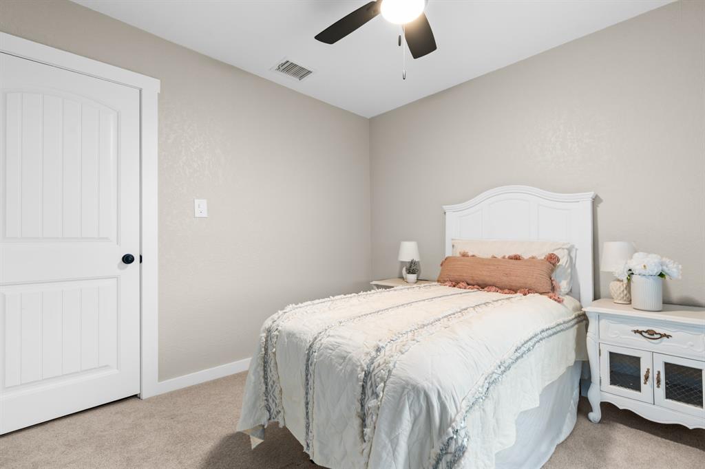 175 Hcr-4434 Itasca, TX 76055 - Photo 18 of 30 a bedroom with a bed and a chandelier