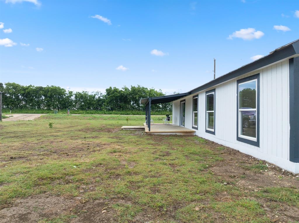 175 Hcr-4434 Itasca, TX 76055 - Photo 24 of 30 a swimming pool with some trees in the background