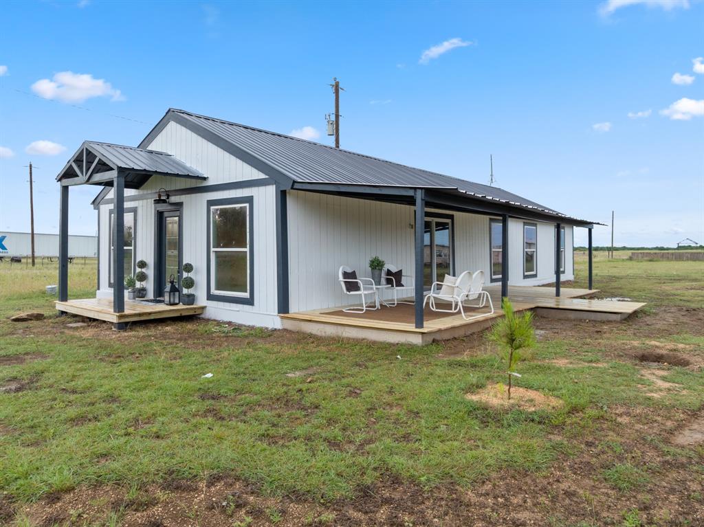 175 Hcr-4434 Itasca, TX 76055 - Photo 25 of 30 a view of a house with swimming pool and a yard