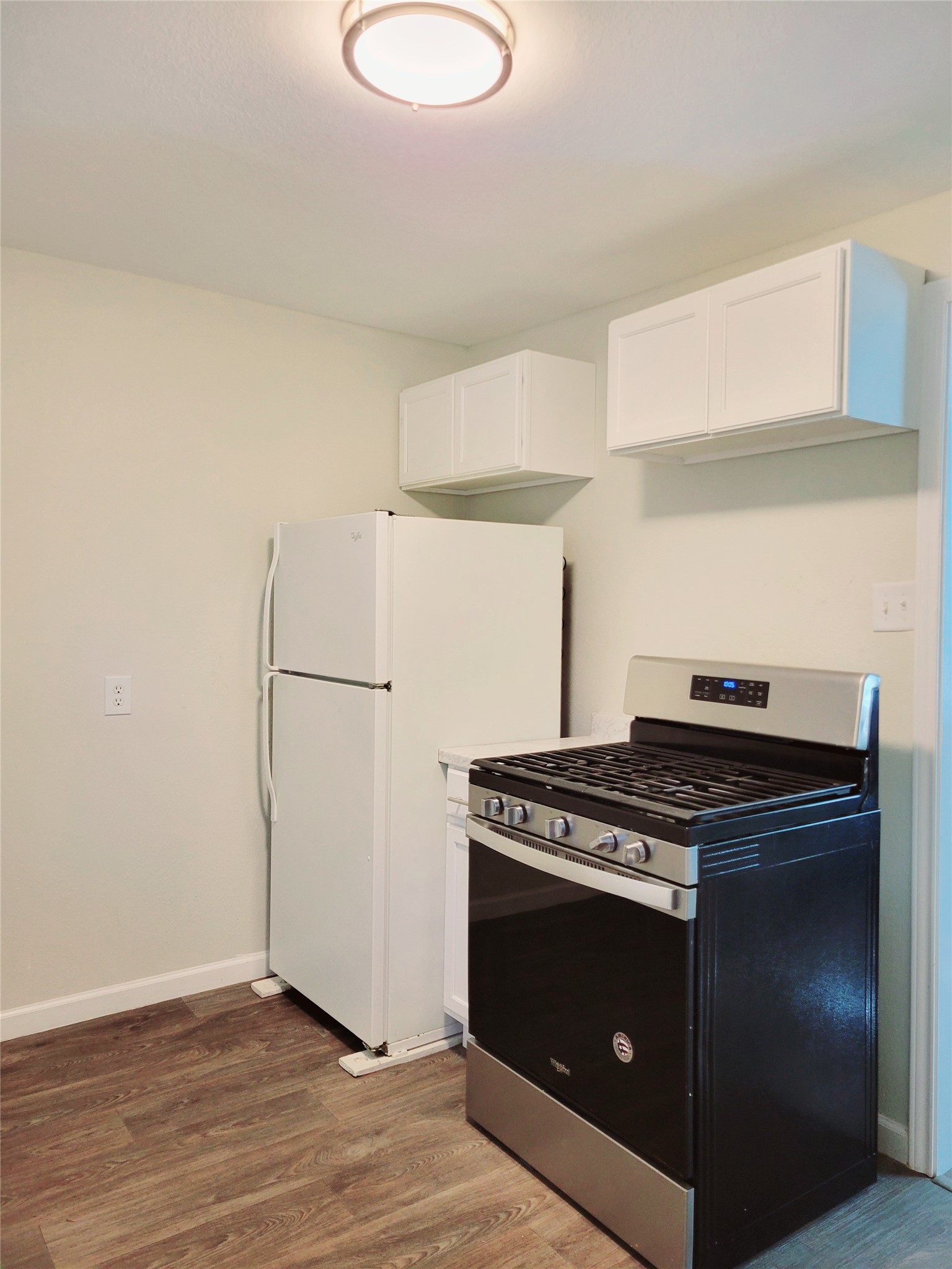 151 Canton San Antonio, TX 78202 - Photo 7 of 10 a kitchen with a stove and a refrigerator