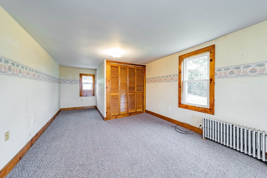 82 Lyman Road Chester, MA 01011 - Photo 23 of 40 a view of an empty room with a window