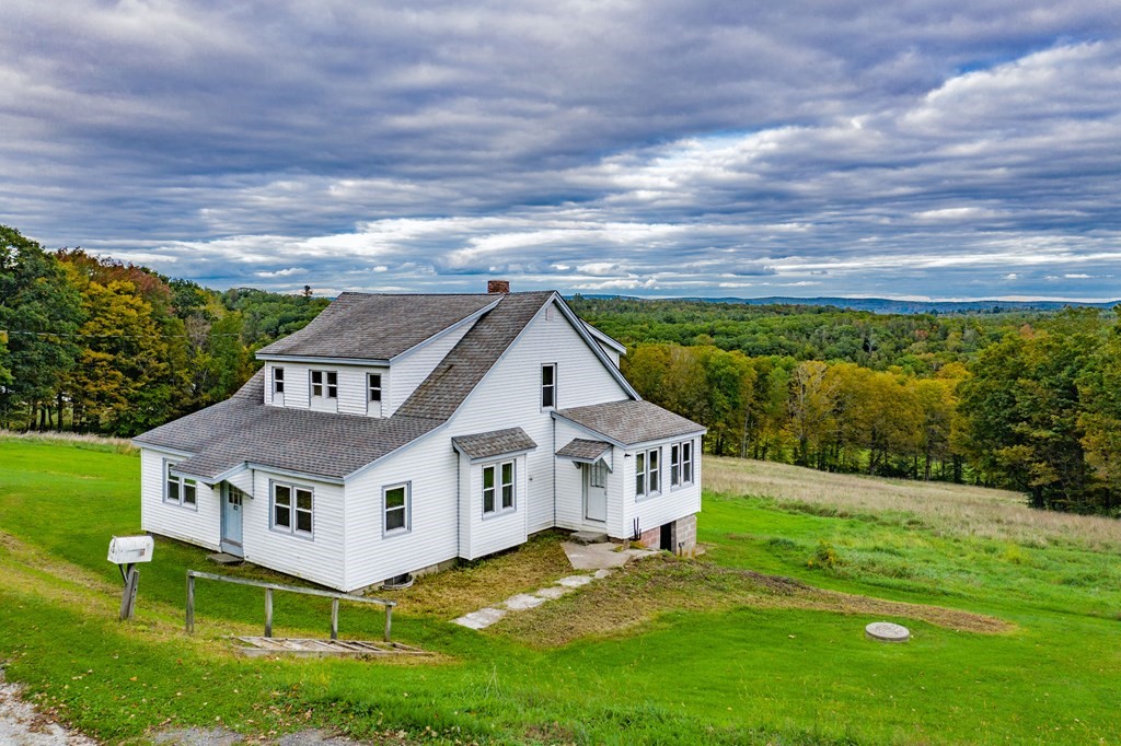 82 Lyman Road Chester, MA 01011 - Photo 3 of 40 a aerial view of a house with a big yard