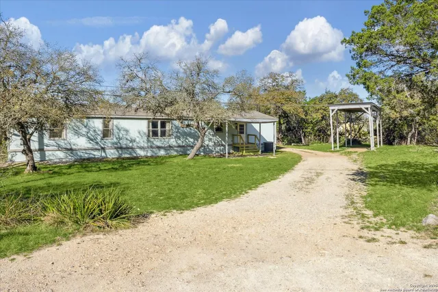 a view of a house with a yard