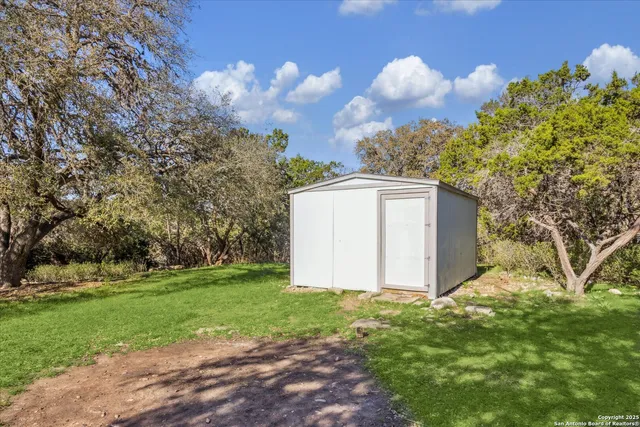 a view of a backyard of the house