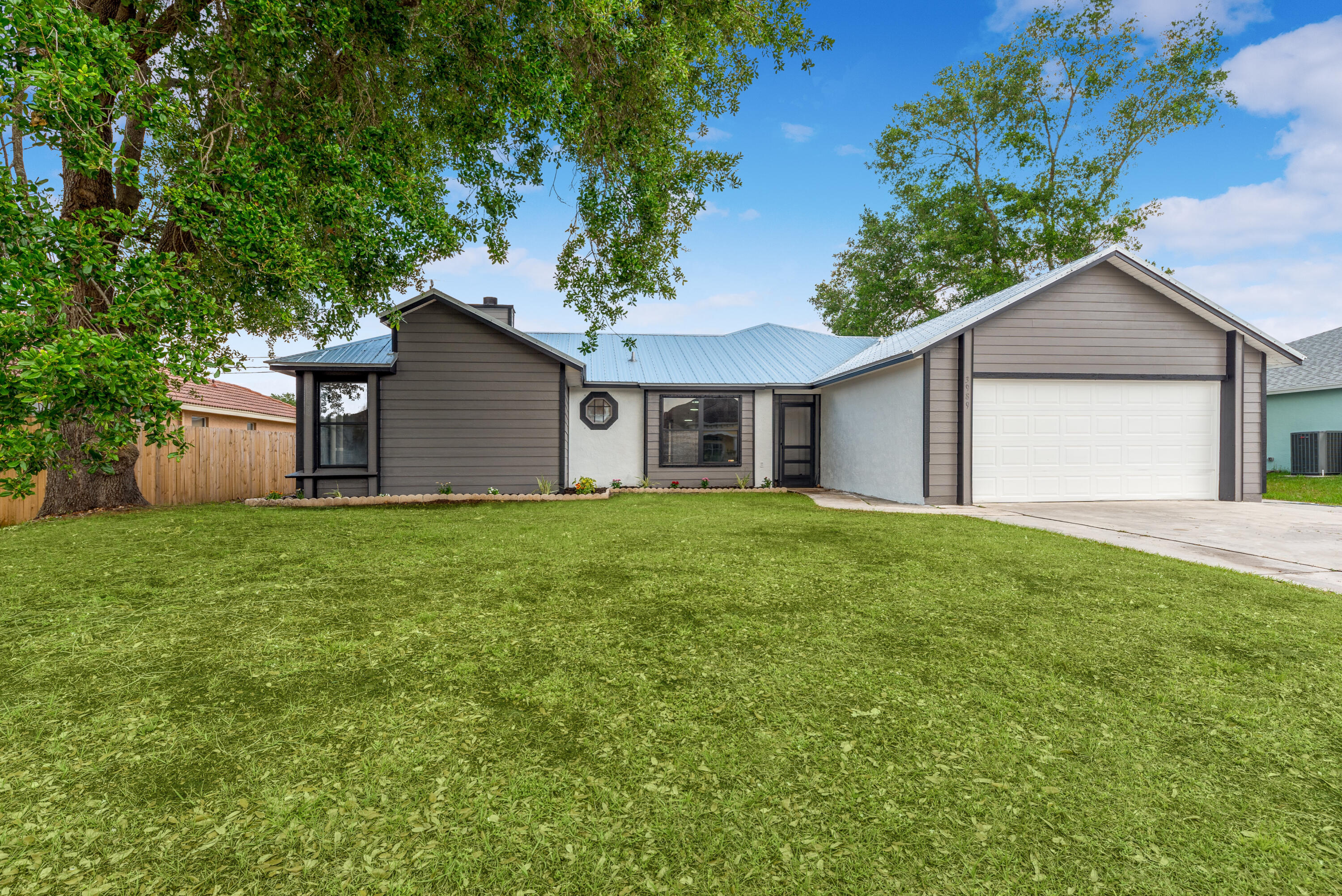 3989 Southwest Jarmer Road Port St. Lucie, FL 34953 - Photo 1 of 20 858134C6-3A9C-40B7-8A38-693BF5093F46