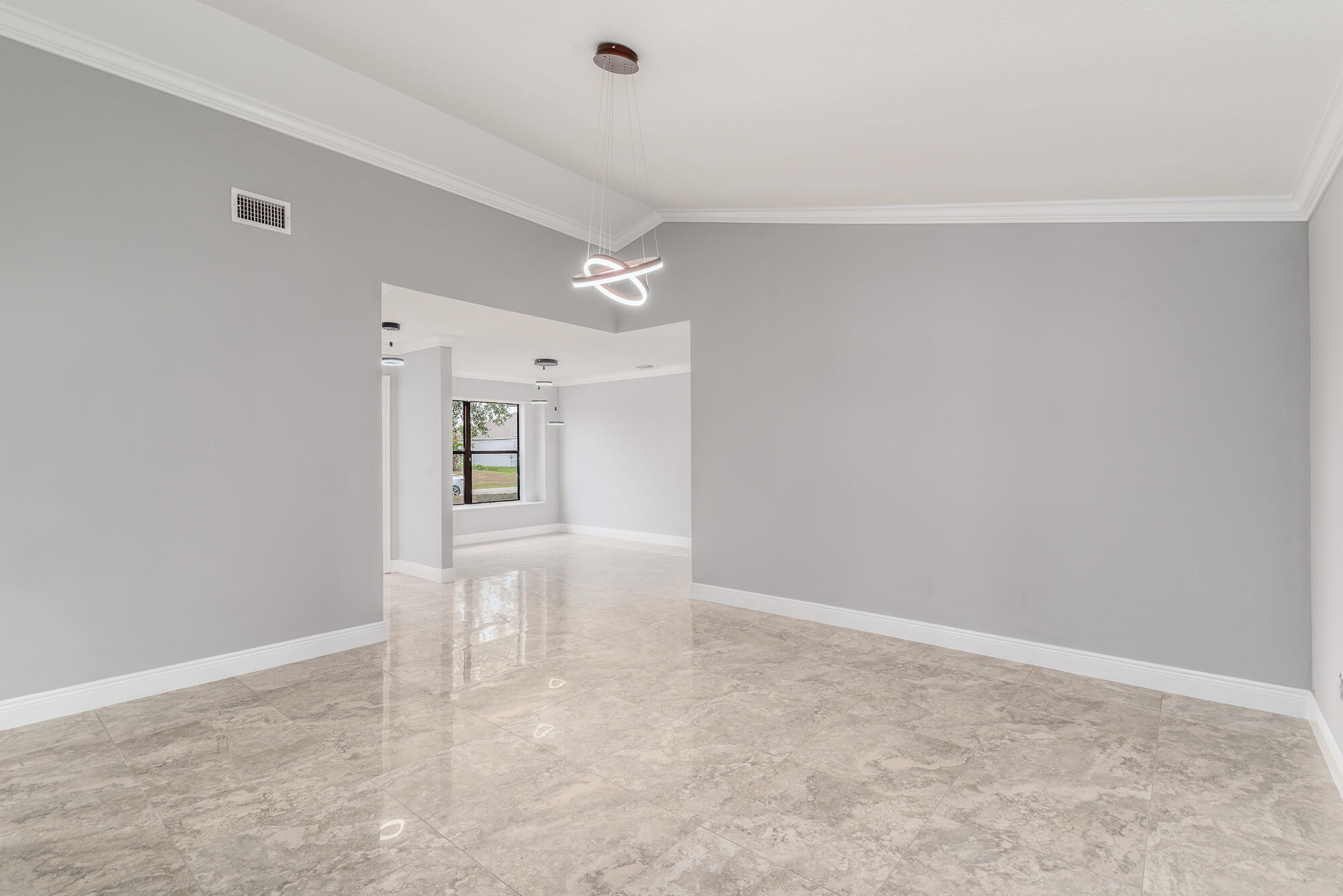3989 Southwest Jarmer Road Port St. Lucie, FL 34953 - Photo 8 of 20 Family room.