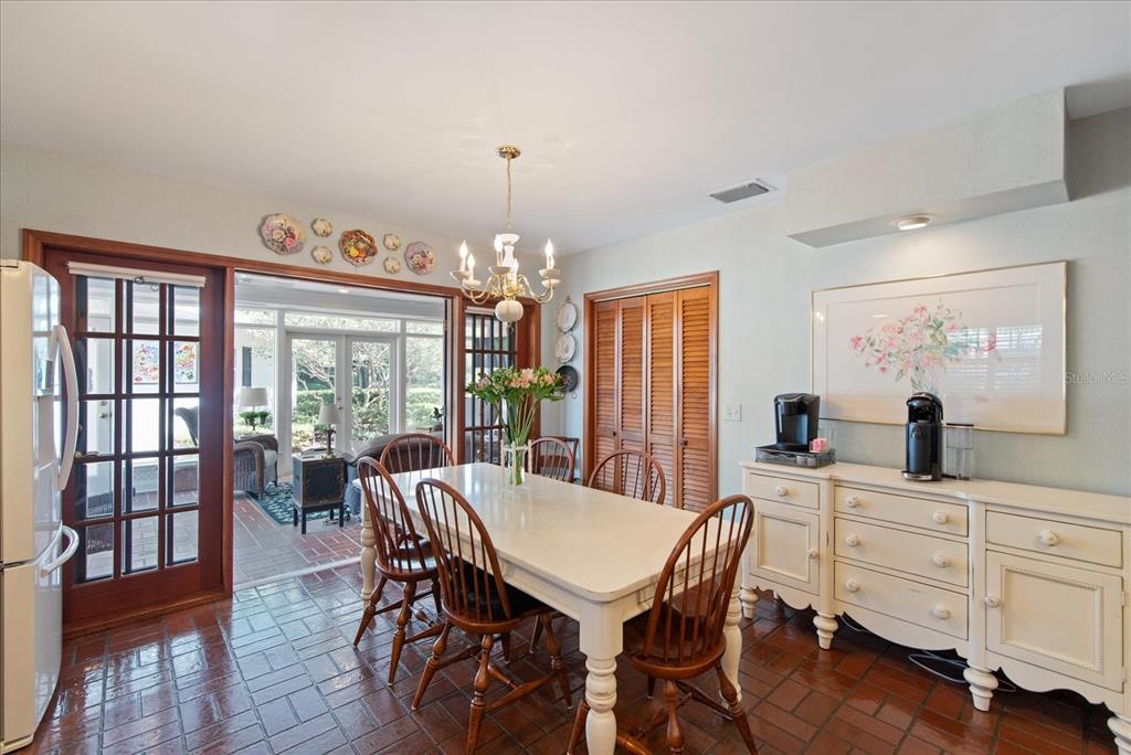 1506 South Sheridan Forest Drive Tampa, FL 33629 - Photo 12 of 41 a view of a dining room with furniture window and wooden floor