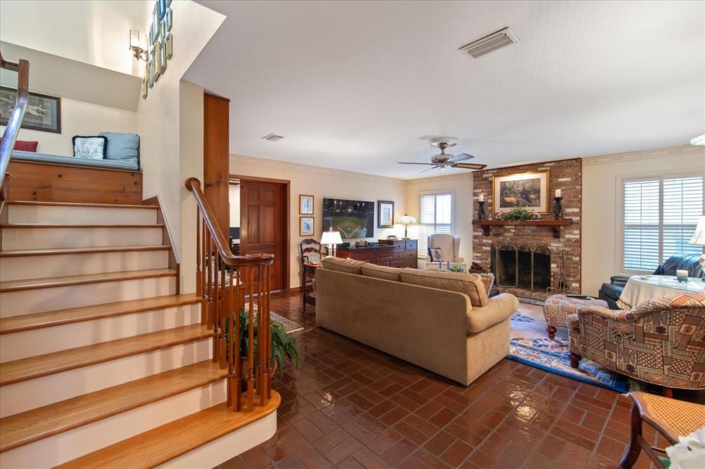 1506 South Sheridan Forest Drive Tampa, FL 33629 - Photo 16 of 41 a living room with furniture and a fireplace