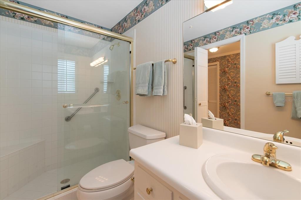 1506 South Sheridan Forest Drive Tampa, FL 33629 - Photo 21 of 41 a bathroom with a sink a toilet and shower