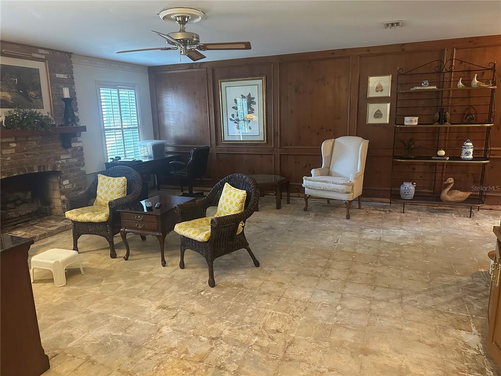 1506 South Sheridan Forest Drive Tampa, FL 33629 - Photo 34 of 41 a living room with furniture a lamp and a window
