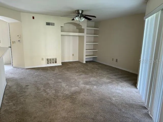 a view of room with racks on the wall