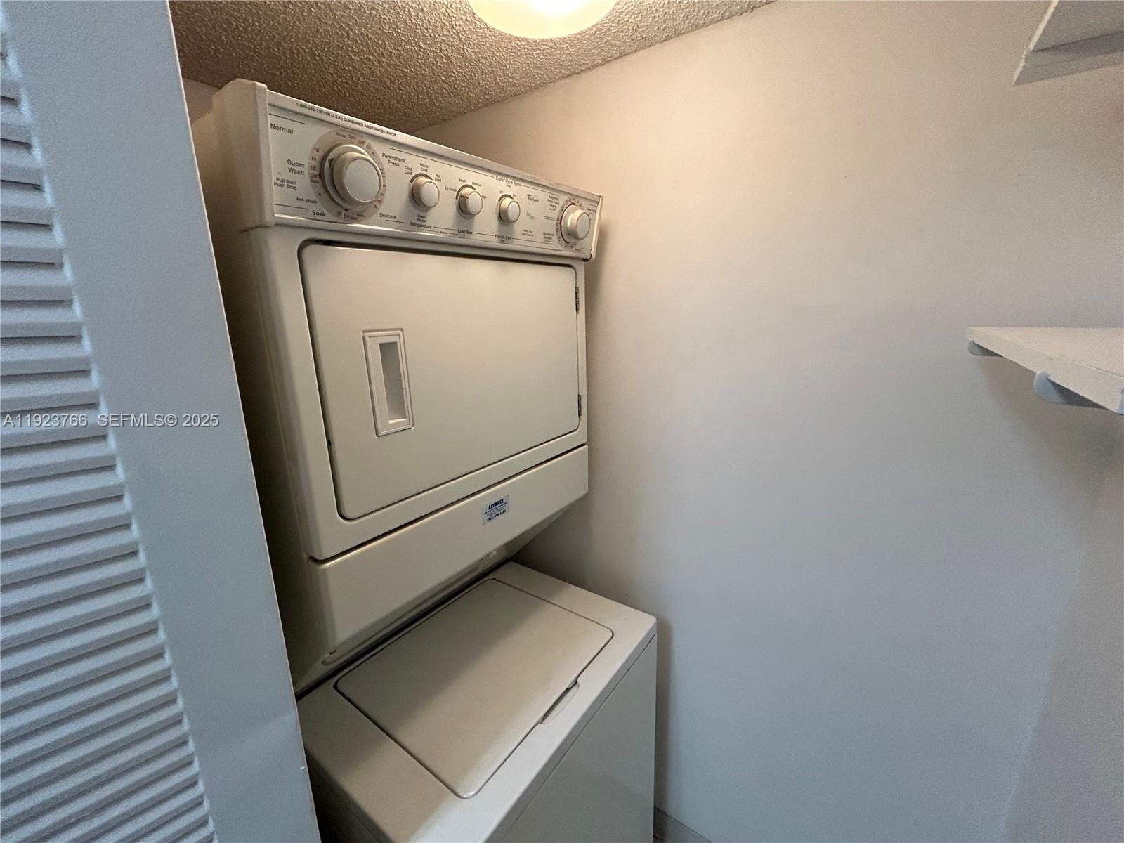 620 South Park Road, Unit 152 Hollywood, FL 33021 - Photo 6 of 14 a utility room with dryer and washer