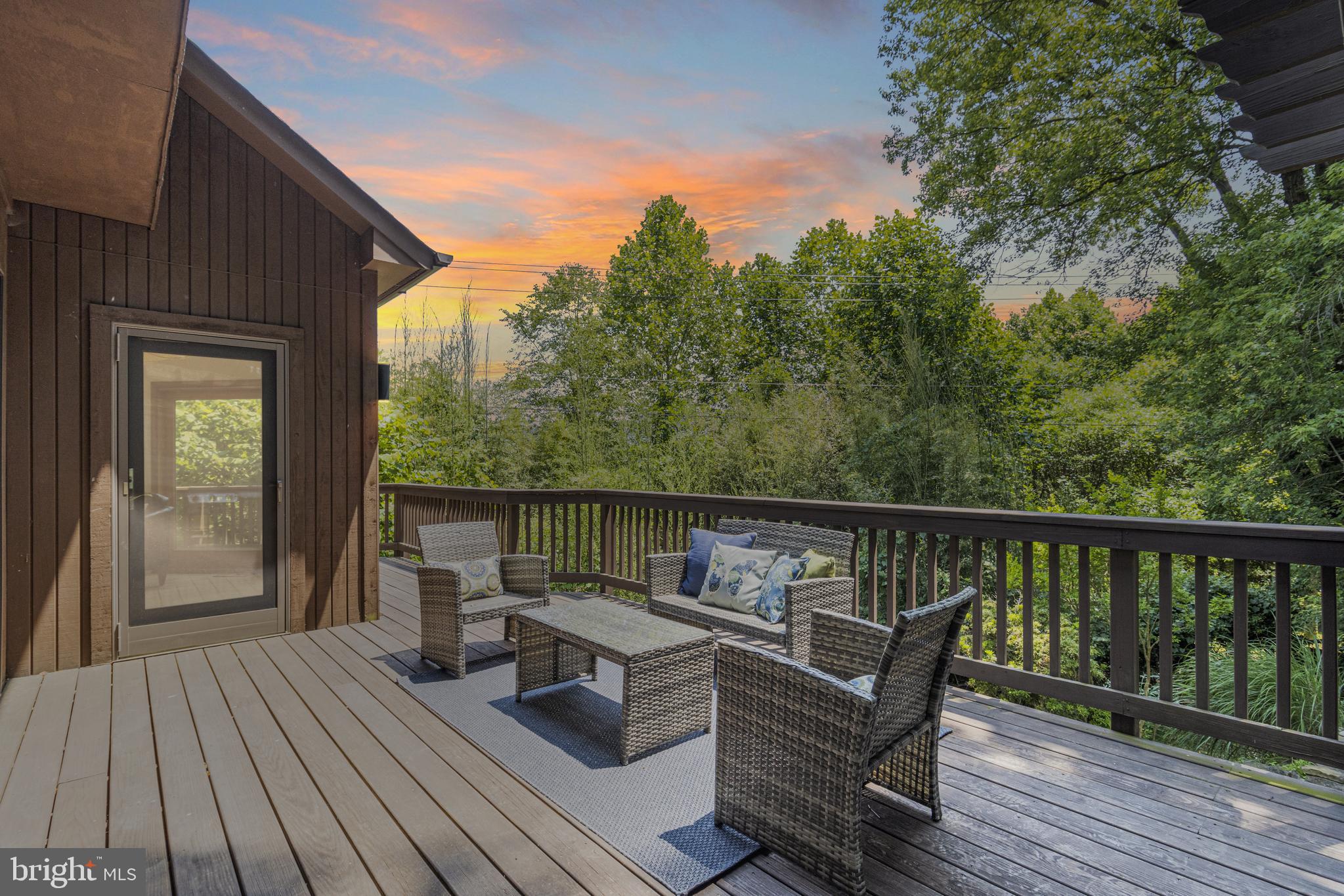 9712 Eldwick Way Potomac, MD 20854 - Photo 19 of 63 a view of a balcony with wooden floor and outdoor seating