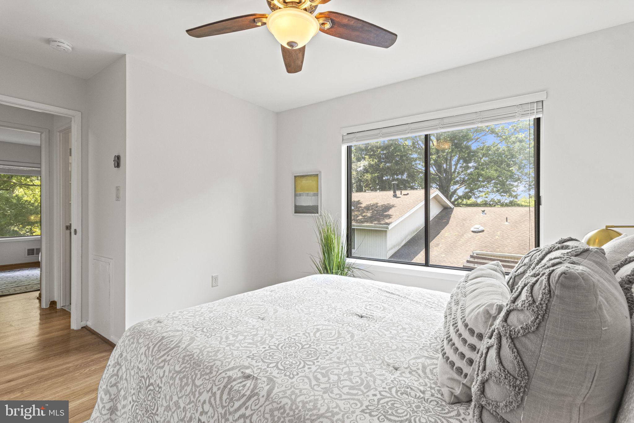 9712 Eldwick Way Potomac, MD 20854 - Photo 28 of 63 a bedroom with a bed and a large window