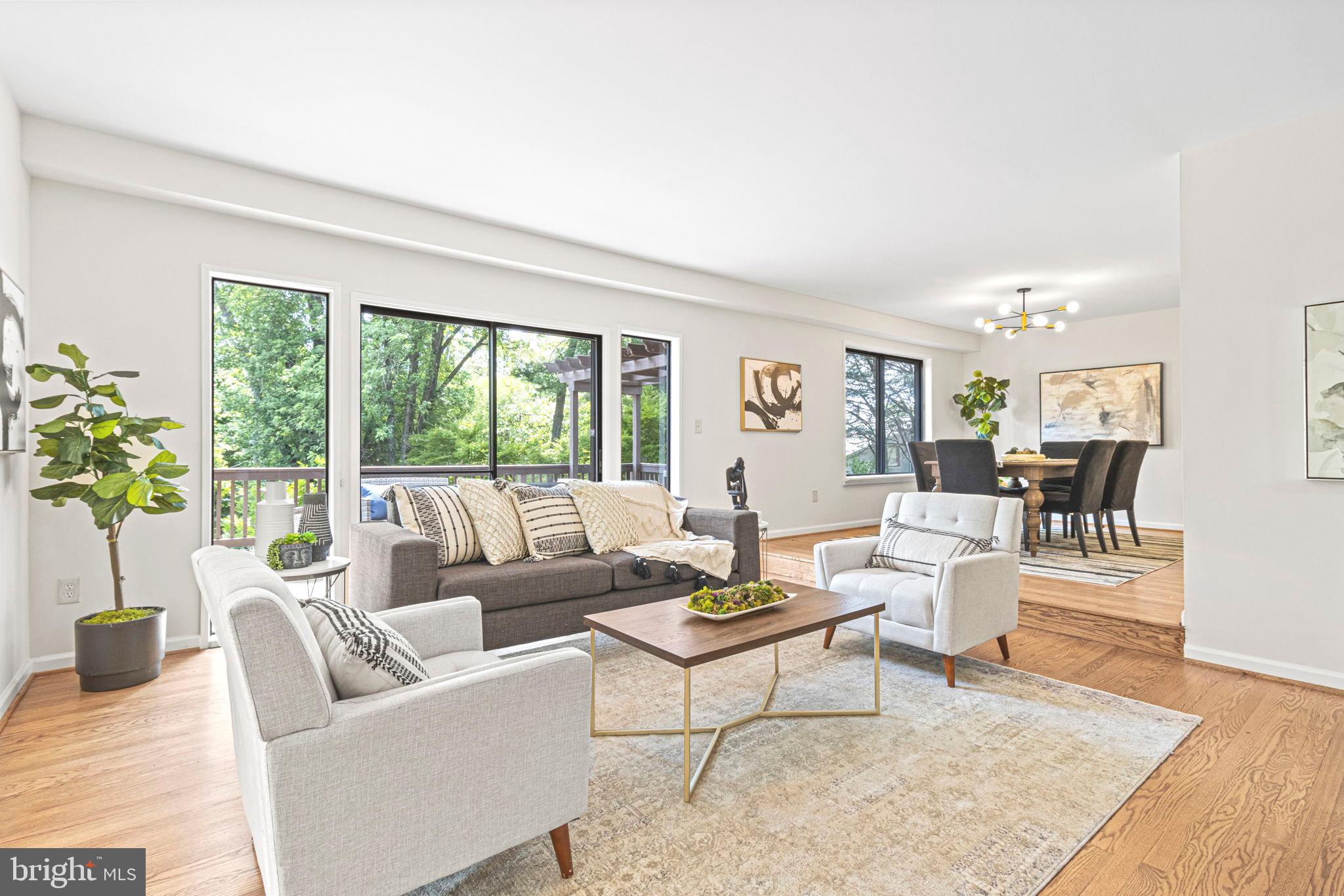 9712 Eldwick Way Potomac, MD 20854 - Photo 6 of 63 a living room with furniture and a large window
