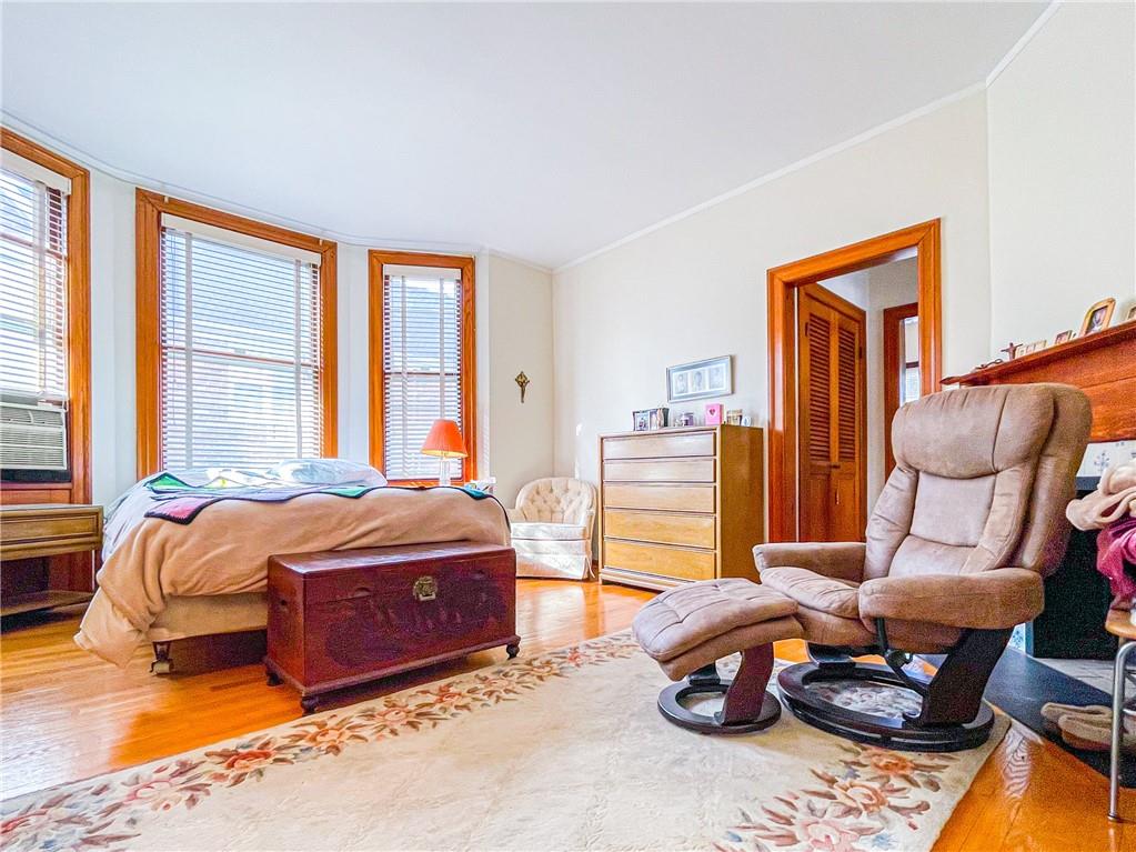 247 82nd Street Brooklyn, NY 11209 - Photo 16 of 48 a bedroom with furniture and large windows