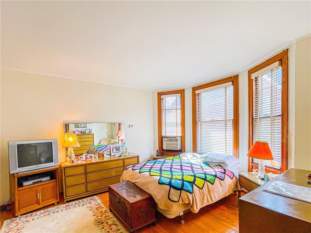 247 82nd Street Brooklyn, NY 11209 - Photo 17 of 48 a living room with furniture and a flat screen tv