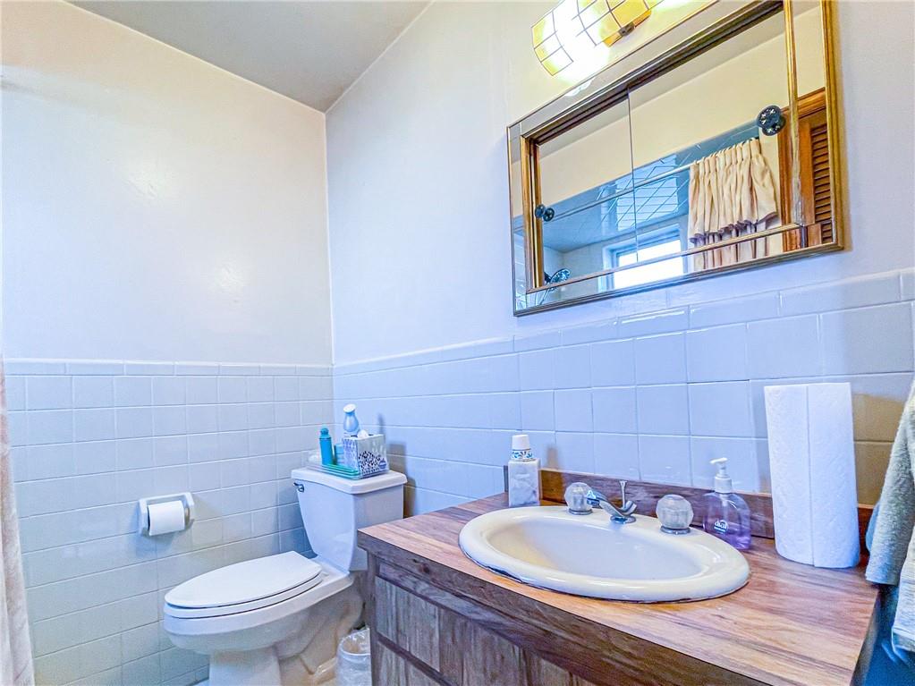 247 82nd Street Brooklyn, NY 11209 - Photo 19 of 48 a bathroom with a sink and a toilet