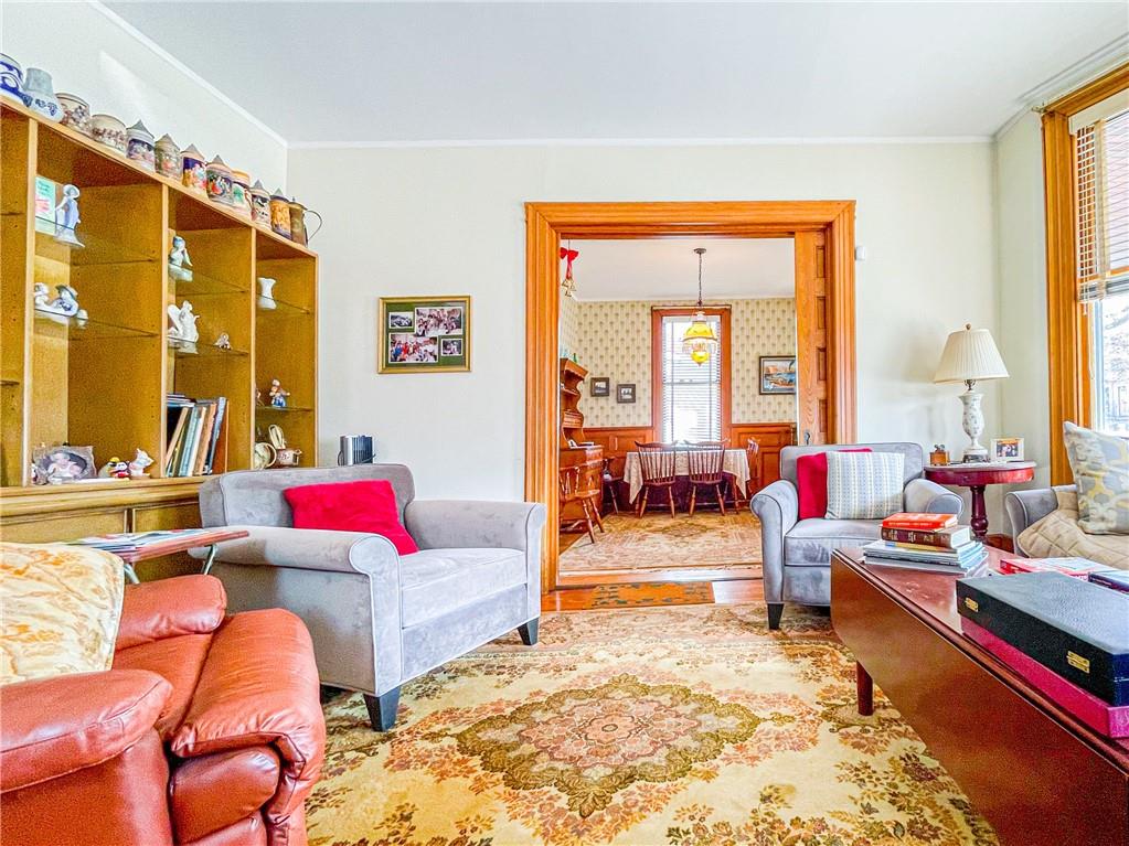 247 82nd Street Brooklyn, NY 11209 - Photo 3 of 48 a living room with furniture and a large window