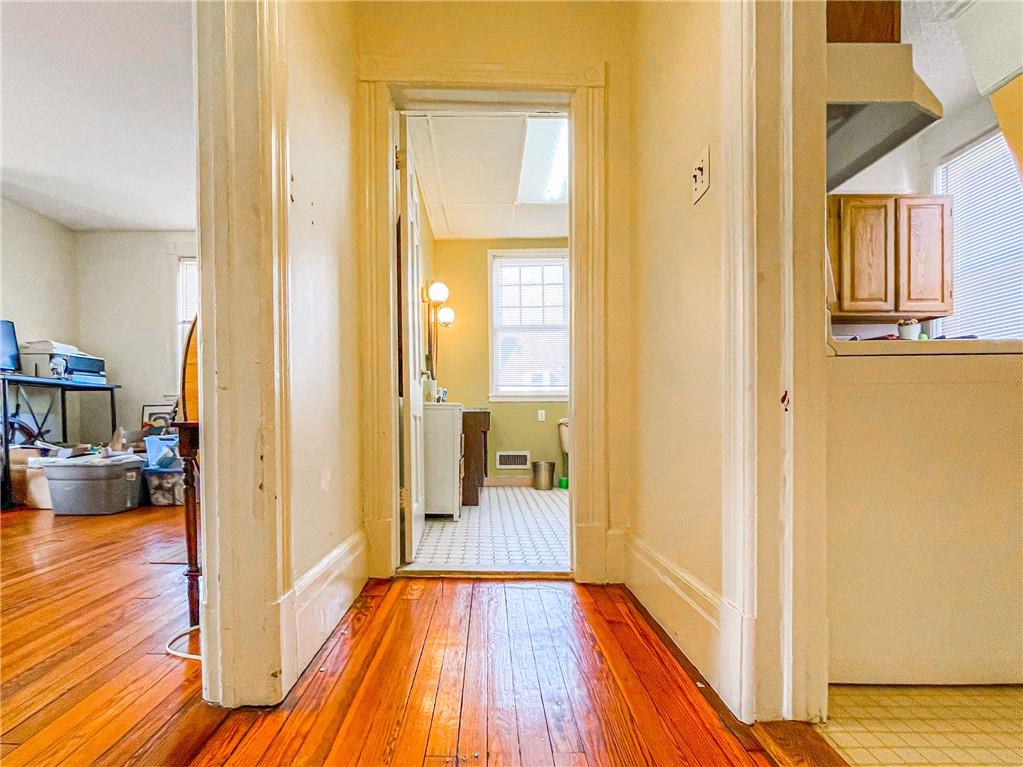247 82nd Street Brooklyn, NY 11209 - Photo 34 of 48 a view of a hallway with wooden floor windows and a livingroom