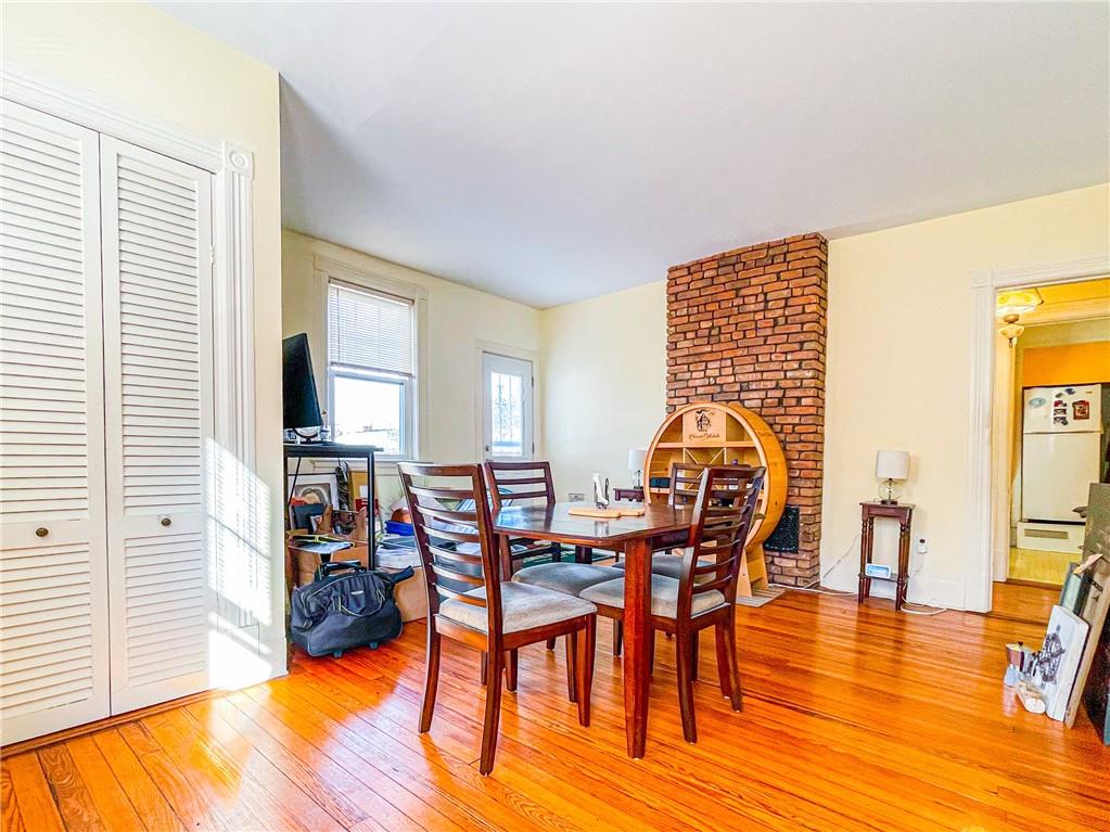 247 82nd Street Brooklyn, NY 11209 - Photo 35 of 48 a view of a dining room with furniture and wooden floor