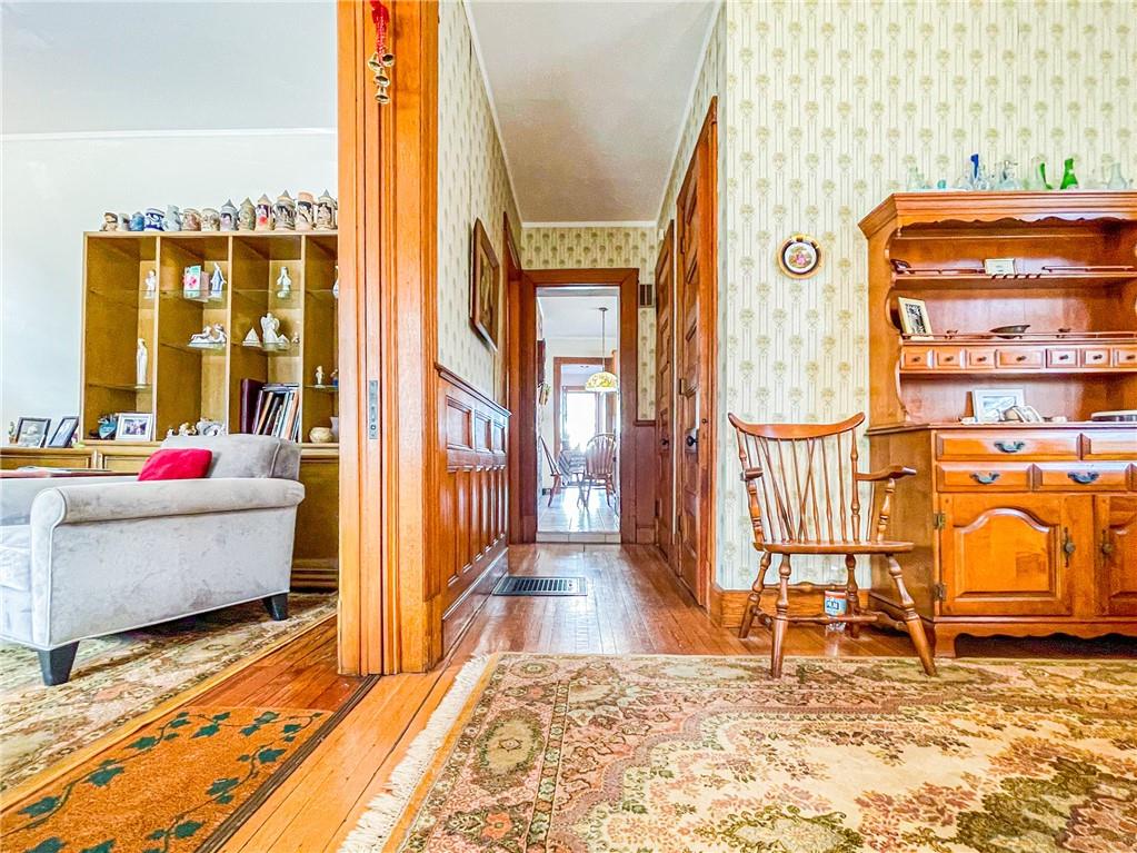 247 82nd Street Brooklyn, NY 11209 - Photo 9 of 48 a living room that has a couch and dresser with wooden floor