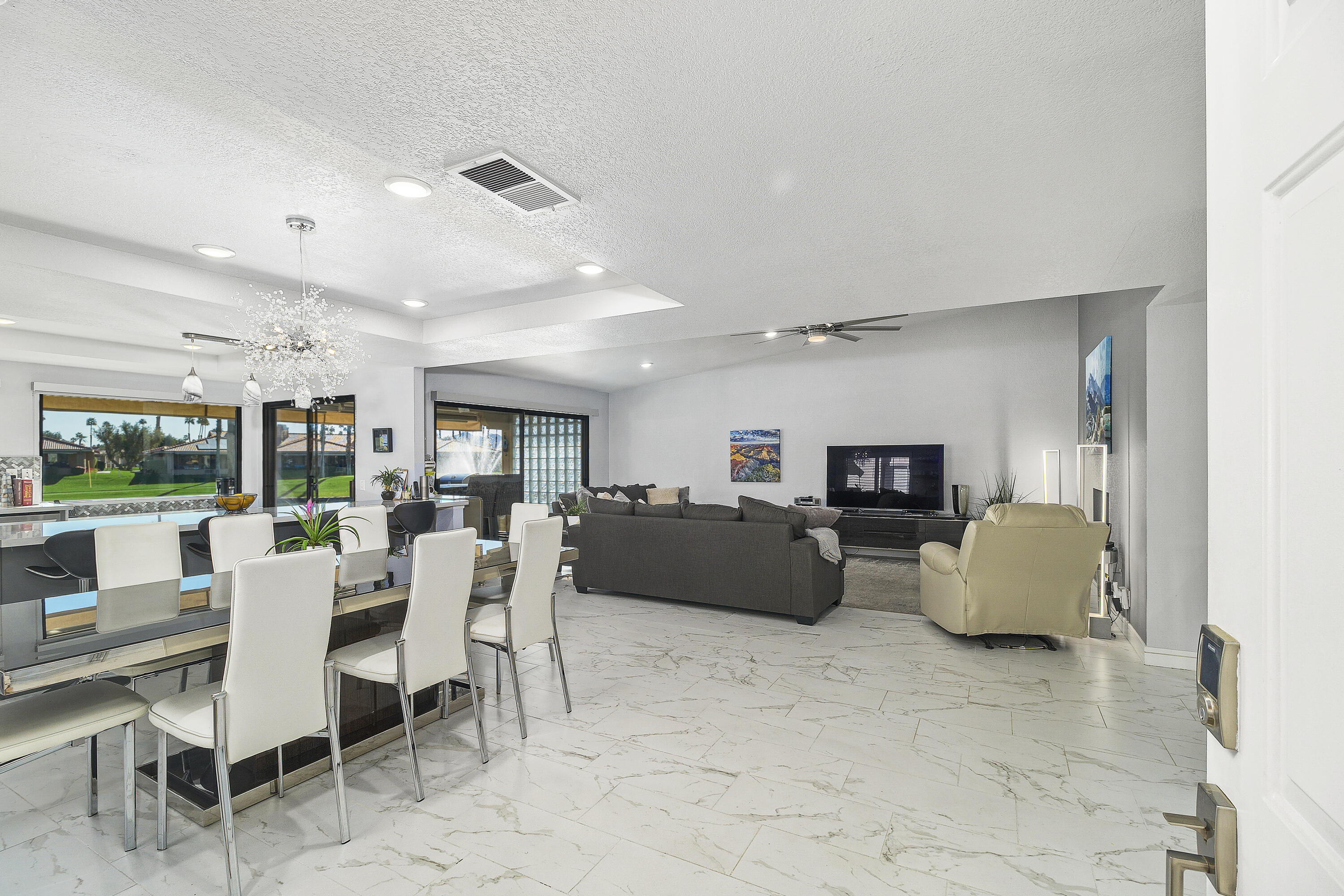 43 Conejo Circle Palm Desert, CA 92260 - Photo 17 of 58 a living room with furniture and a large window