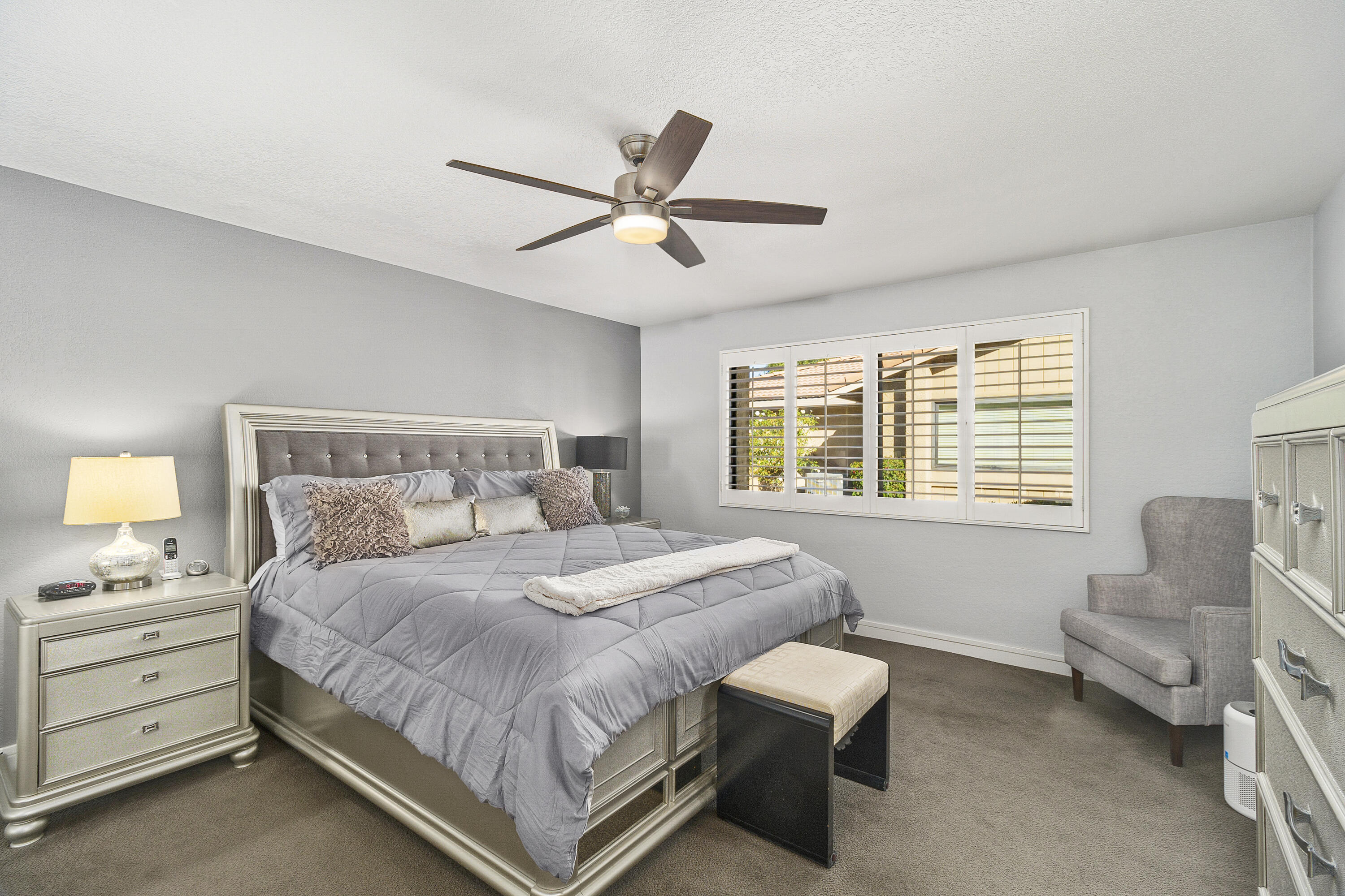 43 Conejo Circle Palm Desert, CA 92260 - Photo 18 of 58 a bedroom with a bed and a couch